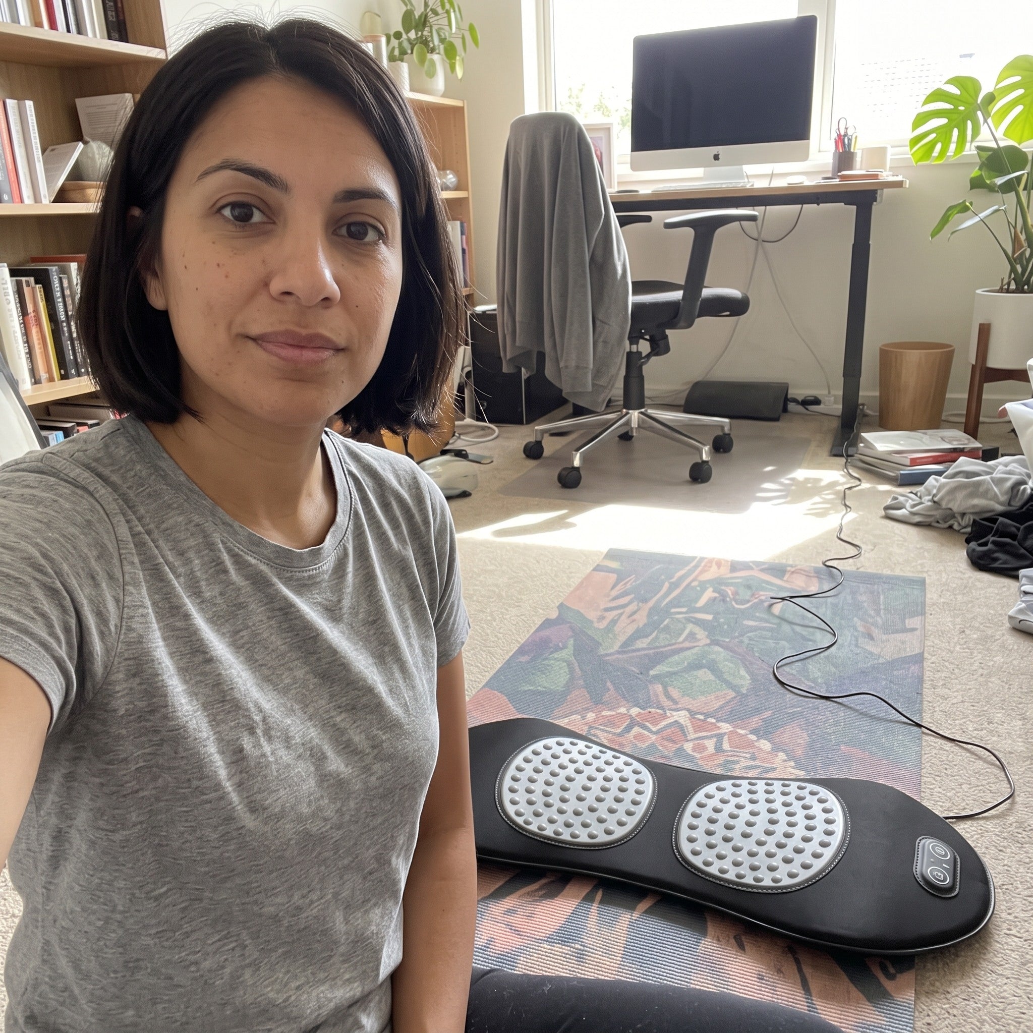 Owner selfie beside Easeback in a home office